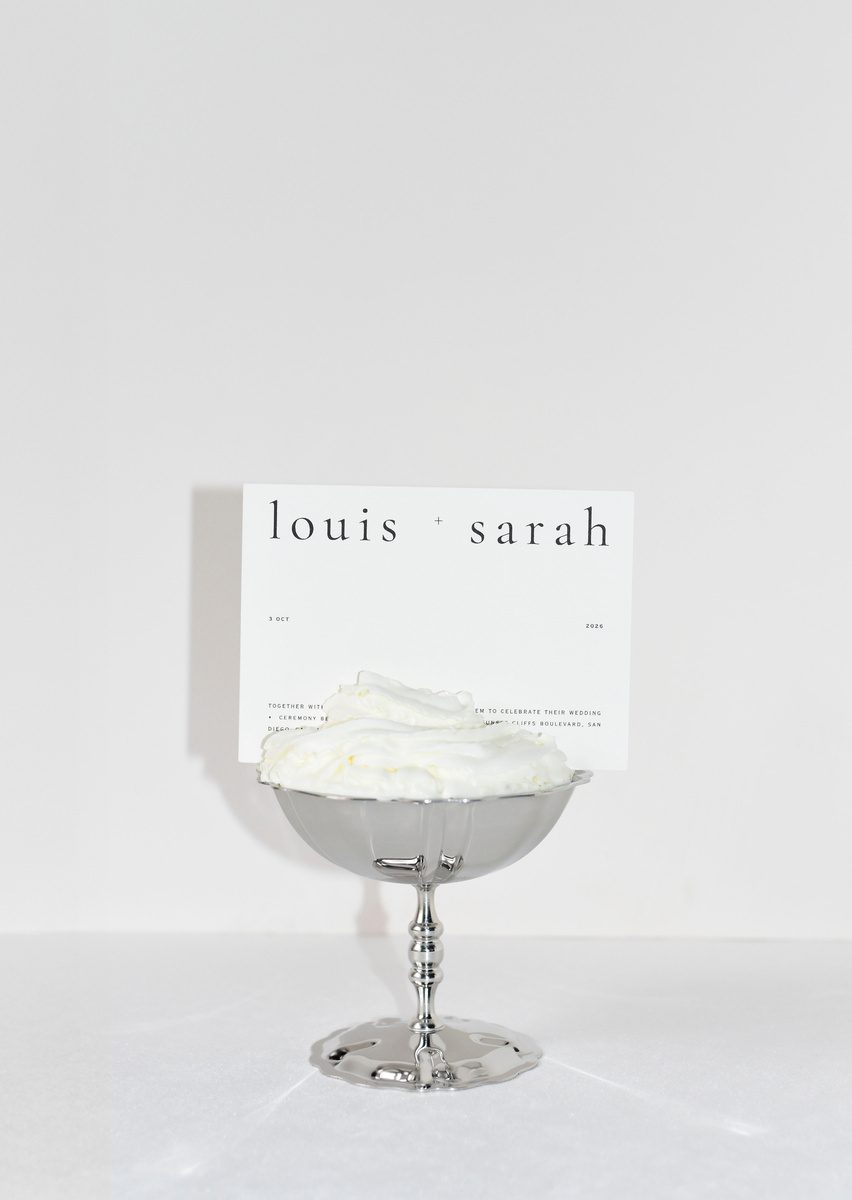 Fashion-forward Louis & Sarah wedding place card in a silver coupe, UTWÖ Studio